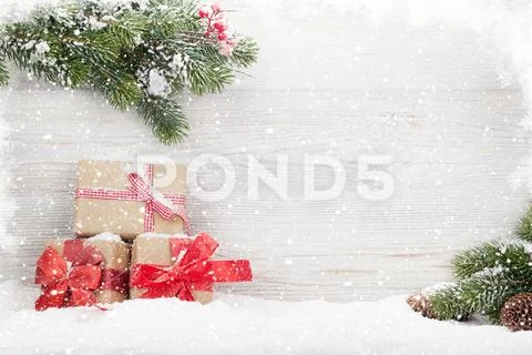 Christmas gift boxes and fir tree branch Stock Photos