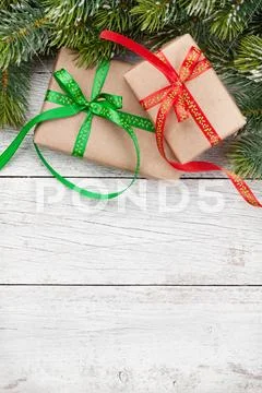 Christmas gift boxes and snow tree Stock Photos