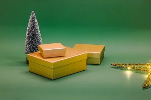 Christmas gift boxes and tree with lights. Christmass decoration on green b.. Stock Photos