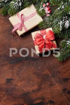 Christmas gift boxes and xmas fir tree Stock Photos