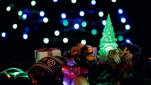 Christmas gift boxes, ball and Christmas tree on bokeh lights Stock Footage 81411615