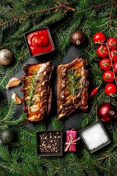 Christmas gift boxes with chocolates and ornaments on pine Stock Photos