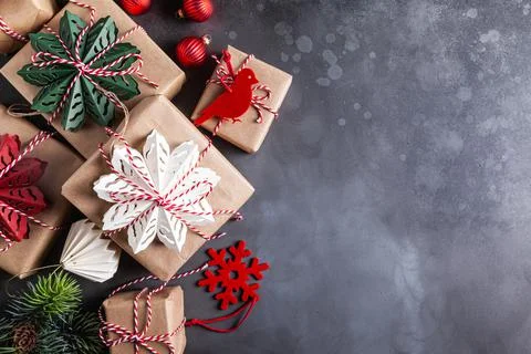 Christmas gift boxes decorated with red, green, white snowflakes made of pape Stock Photos
