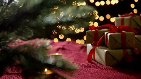 Christmas gift boxes decoration with tree and candles with bokeh lights Stock Footage 80813436