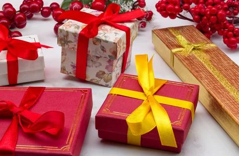 Christmas gift boxes on marble table. Christmas ornaments. Stock Photos