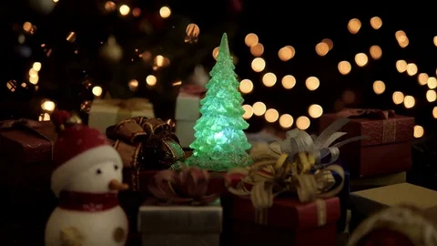 Christmas gift boxes, snowman with blinking light Christmas tree decoration Stock Footage 81362753