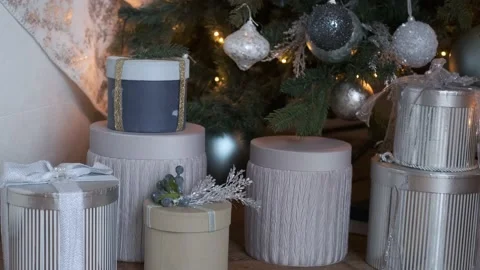 Christmas gift boxes by the tree Stock Footage 145855739