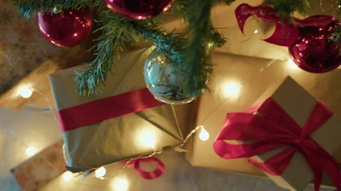 Christmas gift boxes under tree Stock Footage 256025360