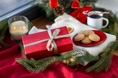 Christmas gift, cookies, candle and fir branch Stock Photos