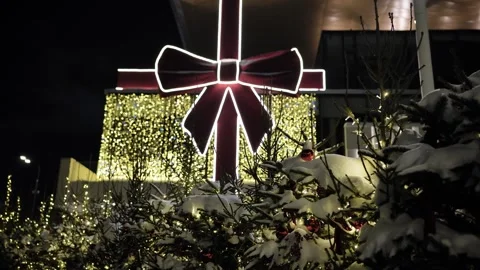 Christmas gift light display illuminating outdoor market at winter night Stock Footage 337064784