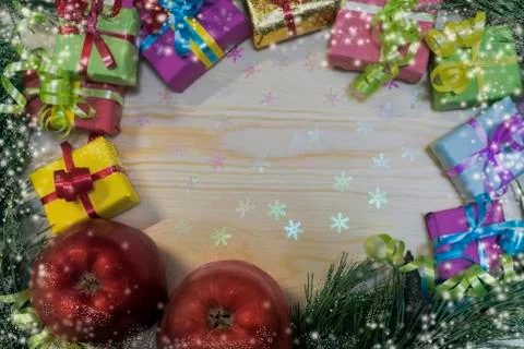 For Christmas, a gift in a multi-colored box lies Stock Photos