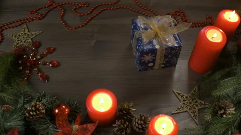 Christmas gift, top-down view. Female hands put a box with a gift on a table Stock Footage 165436426