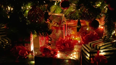 Christmas gift under decorated with light tree Stock Footage 220685302
