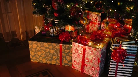 Christmas gift under decorated with light tree Stock Footage 220832929