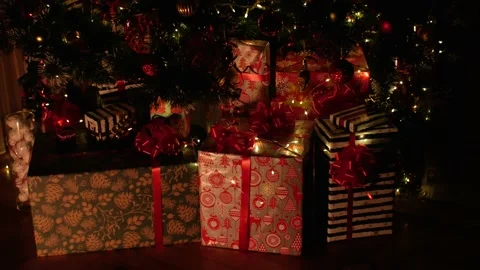 Christmas gift under decorated with light tree Stock Footage 222046757
