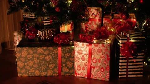Christmas gift under decorated with light tree Stock Footage 222047140