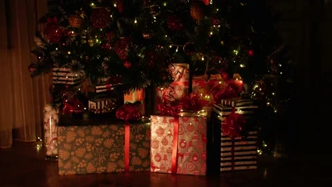Christmas gift under decorated with light tree Stock Footage 224106832