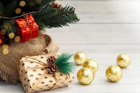 A Christmas gift under the tree. Stock Photos