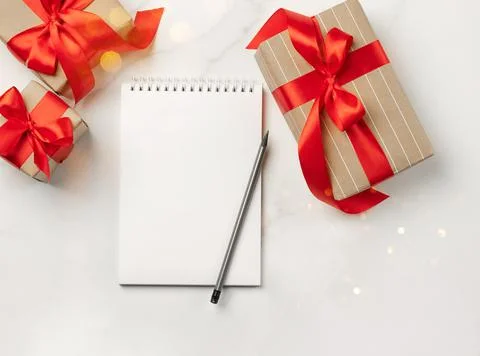 Christmas gifts boxes notepad with text Goals white background New Year concept Stock Photos