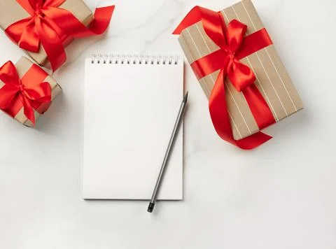 Christmas gifts boxes notepad with text Goals white background New Year concept Stock Photos