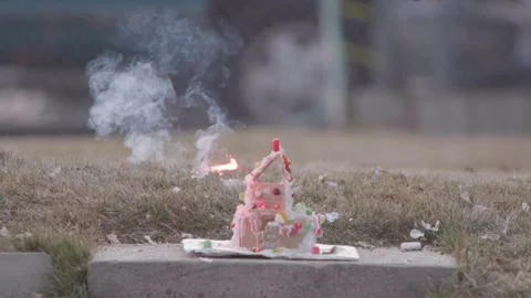 A Christmas ginger bread and graham cracker decoration has a large fire Video stock 140737438