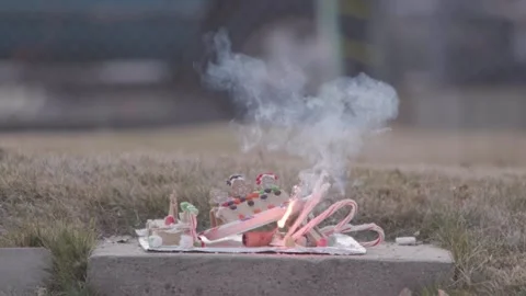 A Christmas ginger bread and graham cracker decoration has a large fire Video stock 140737445