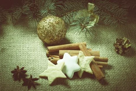Christmas gingerbread cookies on sackcloth with cinnamon and star anis Stock Photos