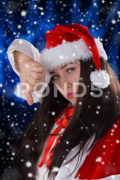 Christmas Girl Thumbs Down Stock Photos