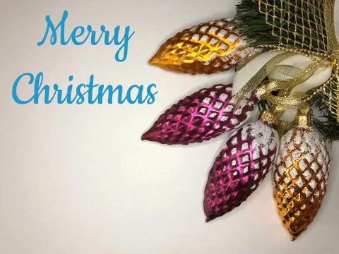 Christmas glass cones on a white background with a blue sign Merry Christmas Foto stock