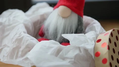 Christmas gnome in gift box on window sill at home Vídeos de archivo 168804323