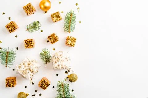 Christmas gold flat lay, composition of gifts boxes and branches Stock Photos