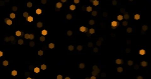 Christmas golden particles sparkle with bokeh flowing on black background Stock Footage