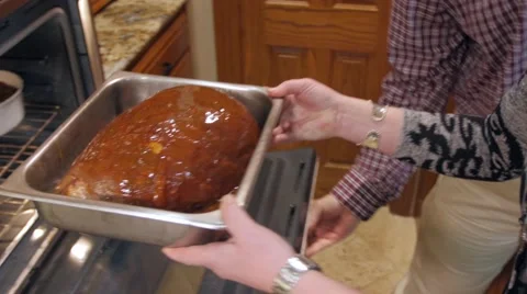 Christmas Ham Going Into the Oven 스톡 동영상 64182988