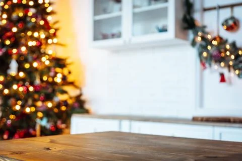 Christmas holiday background with empty rustic table and the bokeh of the liv Stock Photos