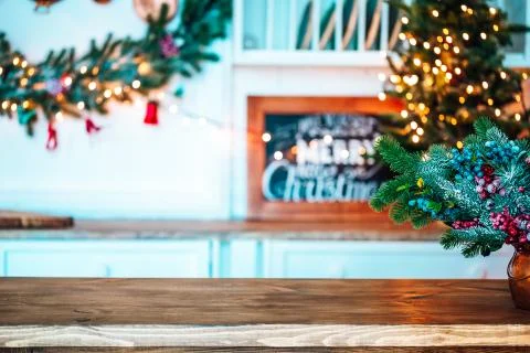 Christmas holiday background with empty rustic table and the bokeh of the liv Stock Photos