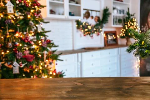 Christmas holiday background with empty rustic table and the bokeh of the liv Stock Photos