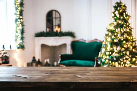 Christmas holiday background with empty rustic table and the bokeh of the liv Stock Photos