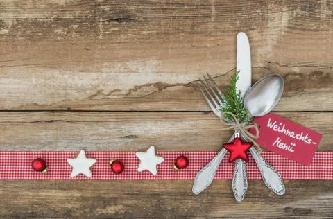 Christmas holiday background with table setting and decoration with tag germa Stock Photos