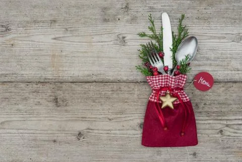 Christmas holiday background with table setting and decoration and menu tag Stock Photos