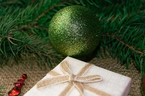 Christmas holidays composition with gift boxes, toys, coniferous tree branch. 스톡 사진