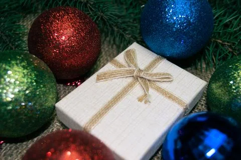 Christmas holidays composition with gift boxes, toys, coniferous tree branch. Stock-Fotos