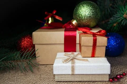 Christmas holidays composition with gift boxes, toys, coniferous tree branch. Stock-Fotos