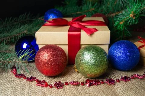Christmas holidays composition with gift boxes, toys, coniferous tree branch. Stock-Fotos