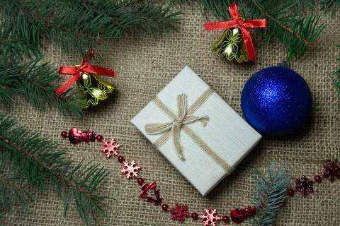 Christmas holidays composition with gift boxes, toys, coniferous tree branch. Stock-Fotos