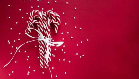 Christmas horizontal background with candy canes Stock Photos
