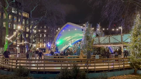Christmas Ice skating at Hanover Square in London Stock Footage 260244737