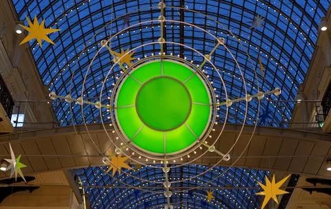 Christmas installation in the mall in the shape of a glowing green emerald. Stock Photos