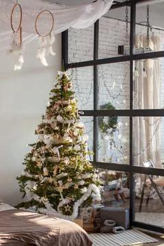 Christmas interior with bed. Stock Photos