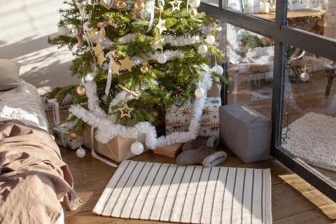 Christmas interior with bed. Stock Photos