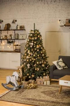 Christmas interior with elegant Christmas tree and rocking horse Stock Photos